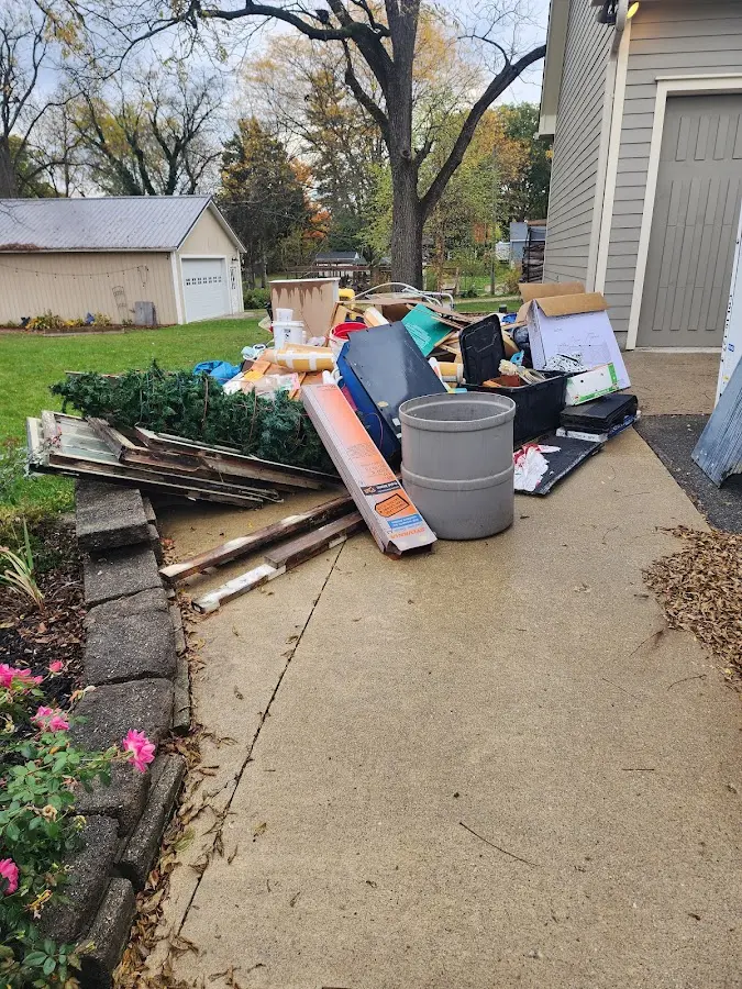 Dumpster being loaded with debris for 30 Yard Dumpster Rental in Lake Worth